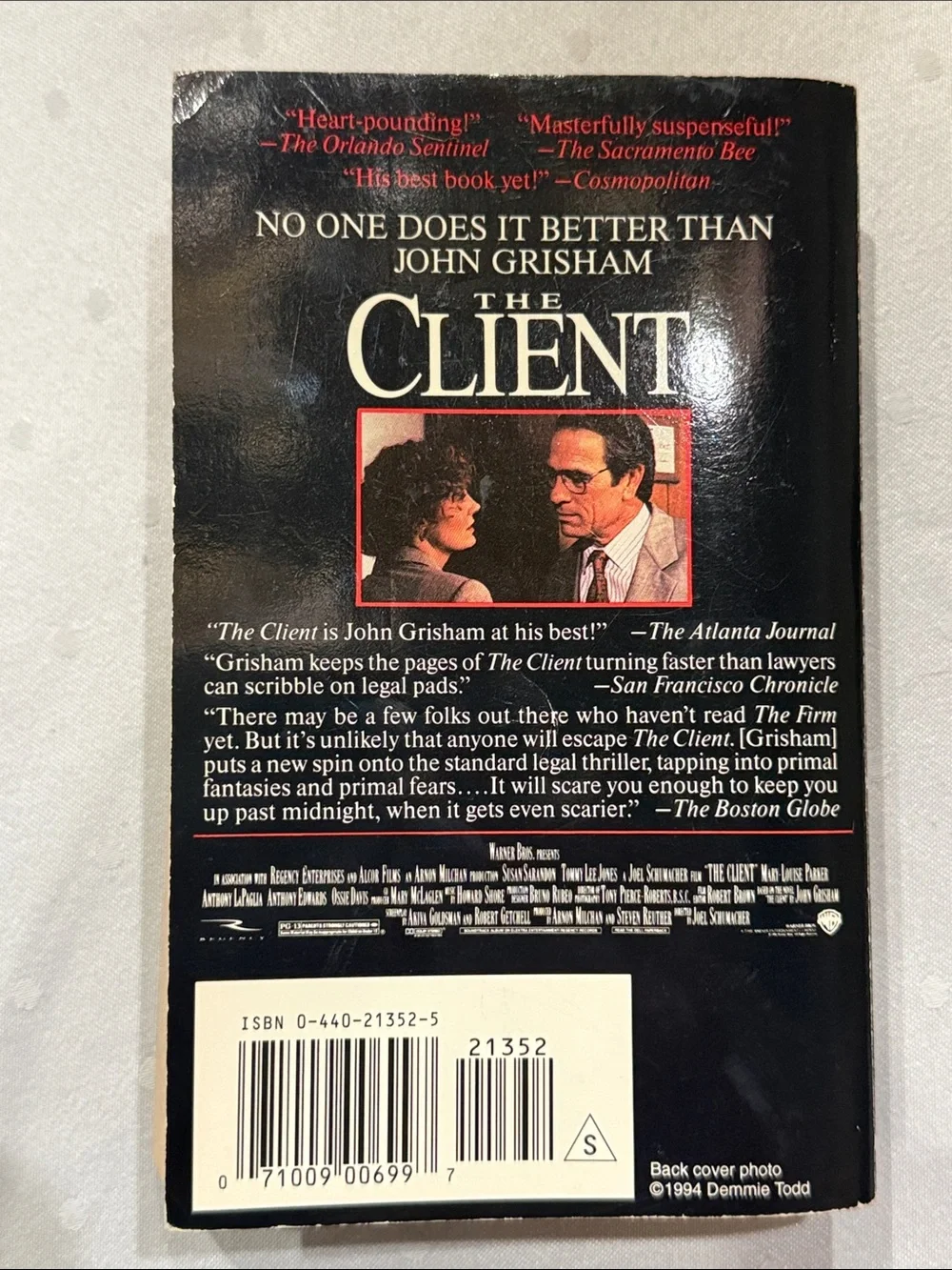 “The Client” a paperback novel by John Grisham